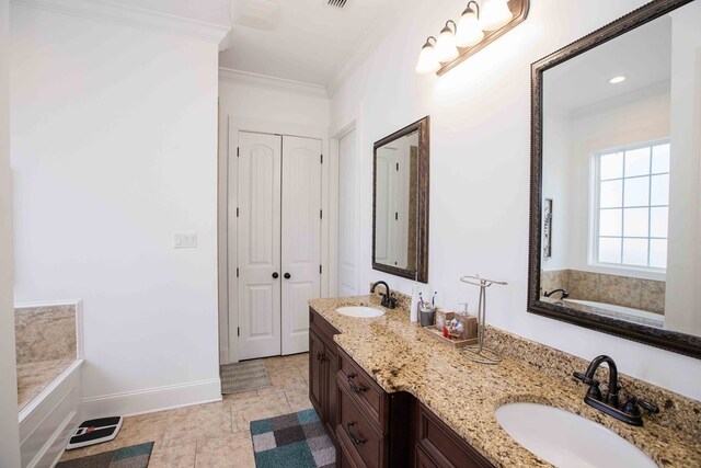 bathroom featuring ornamental molding, a bathing tub, and vanity