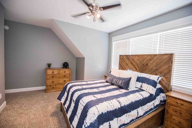 bedroom featuring lofted ceiling, light carpet, and ceiling fan