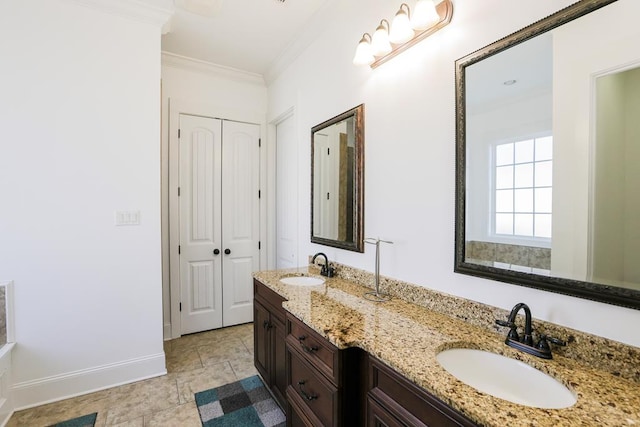 bathroom featuring crown molding and vanity