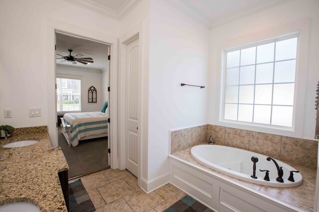 bathroom featuring ornamental molding, a washtub, and vanity