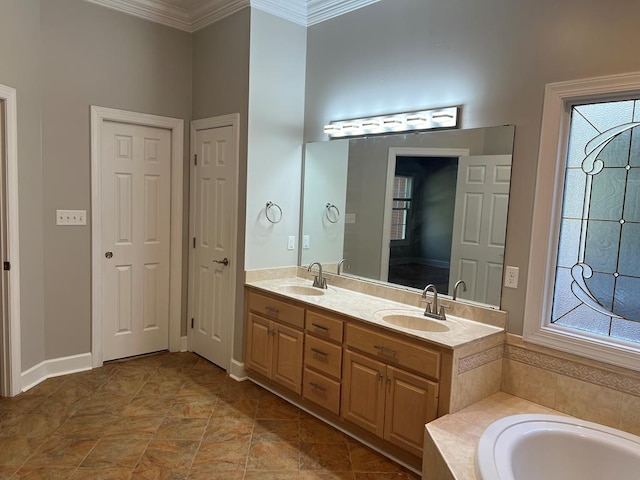 full bath featuring a bath, double vanity, crown molding, and a sink