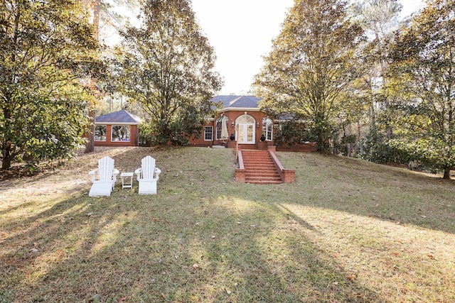 view of yard featuring french doors