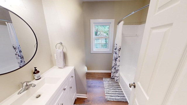 full bathroom with shower / bath combination with curtain, vanity, toilet, and hardwood / wood-style flooring