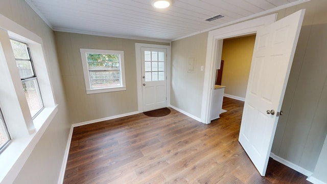 doorway to outside featuring crown molding, hardwood / wood-style flooring, and wooden ceiling