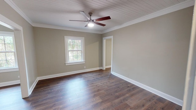 spare room with dark hardwood / wood-style flooring, crown molding, and ceiling fan