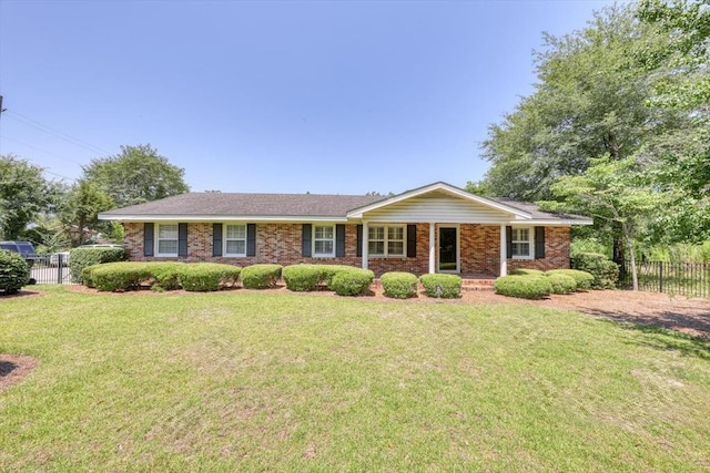 ranch-style house featuring a front yard