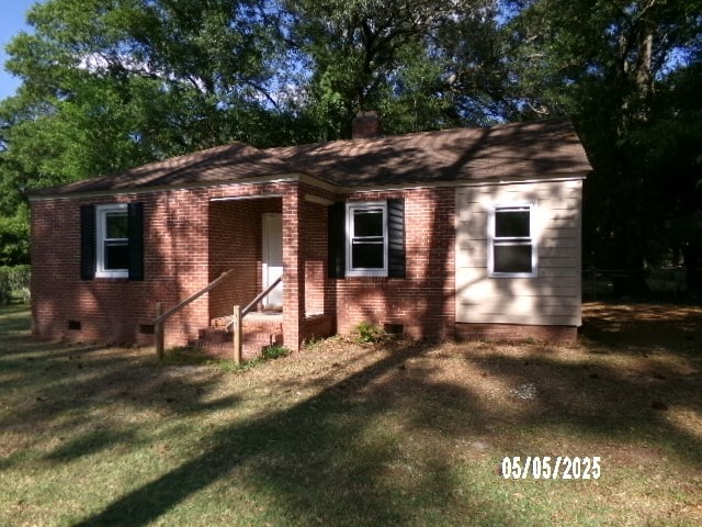 320 Camellia Ct, Camilla, GA 31730 - view of front of property with a chimney, a front yard, brick siding, and crawl space
