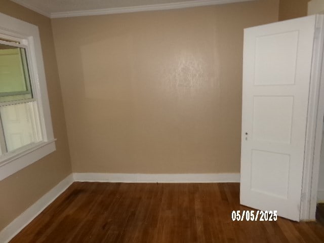 320 Camellia Ct, Camilla, GA 31730 - empty room with ornamental molding, baseboards, and dark wood-type flooring