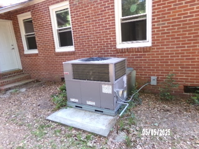 320 Camellia Ct, Camilla, GA 31730 - details with central AC unit, brick siding, and entry steps