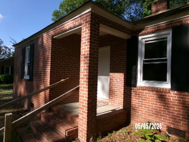 320 Camellia Ct, Camilla, GA 31730 - view of property exterior with a chimney and brick siding