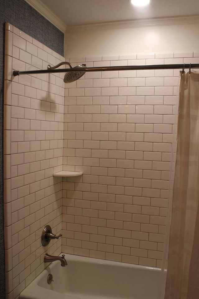 bathroom with ornamental molding and shower / bath combo with shower curtain