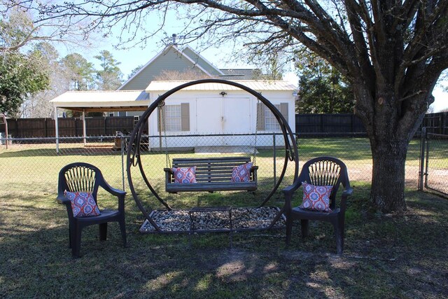 view of property's community with a yard and fence