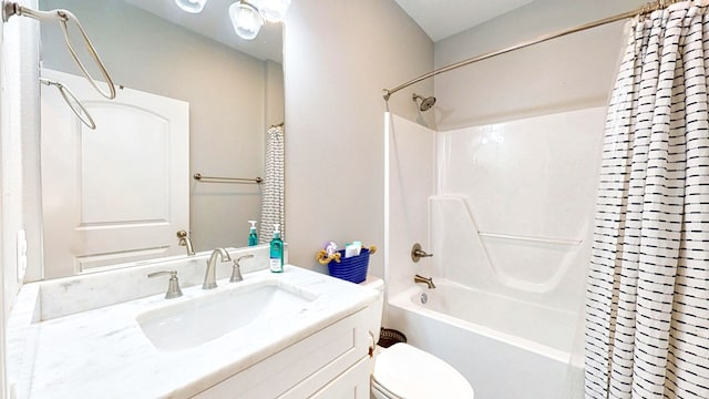 full bathroom featuring shower / bath combo, vanity, and toilet