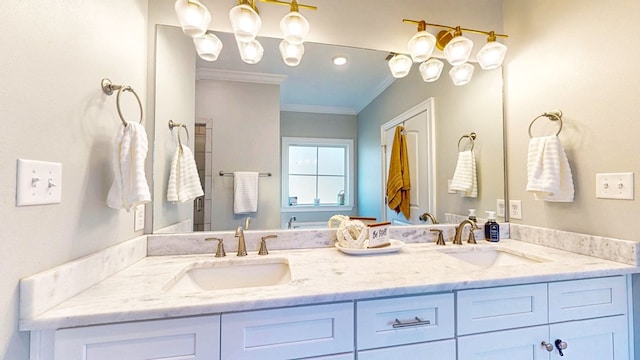 bathroom with ornamental molding, a sink, and double vanity