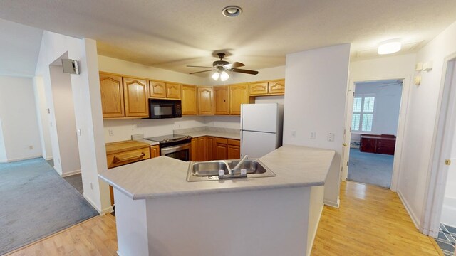 kitchen with sink, stainless steel range with electric cooktop, white refrigerator, kitchen peninsula, and light hardwood / wood-style floors