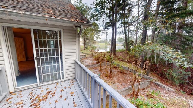 wooden deck featuring a water view