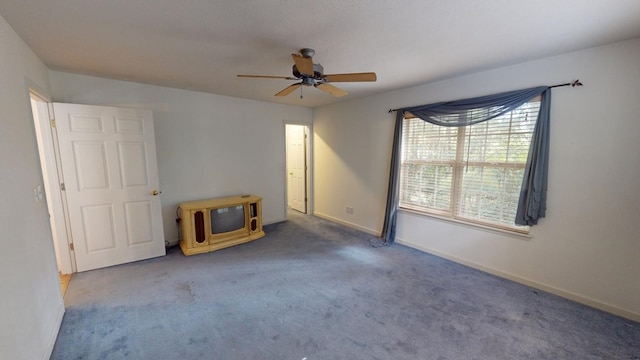 carpeted empty room with ceiling fan