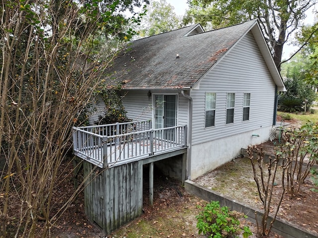 view of side of property with a deck