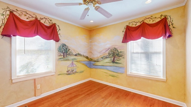 spare room with ornamental molding, hardwood / wood-style floors, and ceiling fan