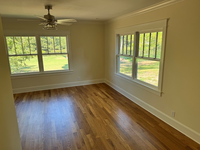 unfurnished room featuring ornamental molding, dark hardwood / wood-style floors, and ceiling fan