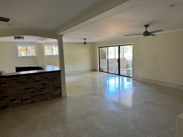 spare room with a wealth of natural light and ceiling fan