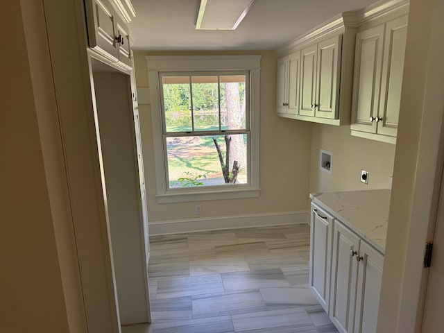 laundry room featuring cabinets, washer hookup, and hookup for an electric dryer