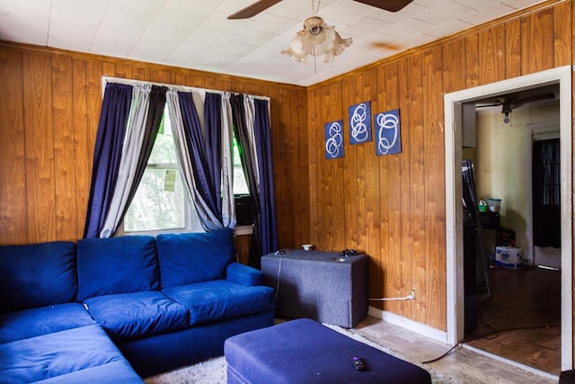 136 SW Pine Cir, Cairo, GA 39828 - living room with ceiling fan, wood walls, baseboards, and wood finished floors