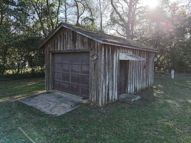 detached garage featuring driveway