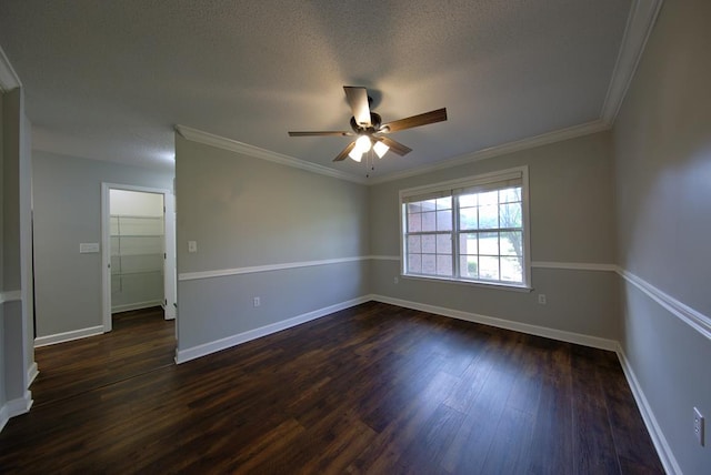 spare room featuring baseboards, crown molding, ceiling fan, and dark wood-style floors
