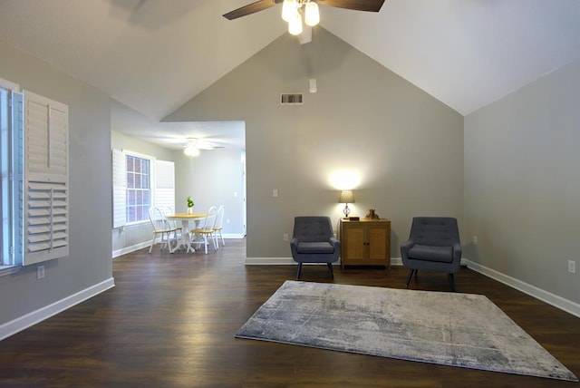 sitting room with visible vents, baseboards, ceiling fan, and high vaulted ceiling