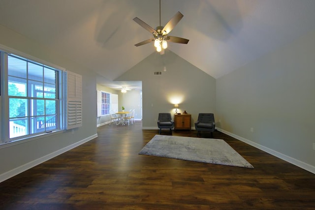 sitting room featuring vaulted ceiling, ceiling fan, baseboards, and dark wood finished floors