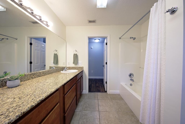 full bath featuring shower / tub combo, baseboards, visible vents, tile patterned flooring, and vanity