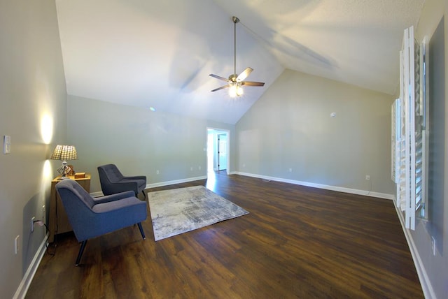 sitting room with baseboards, wood finished floors, lofted ceiling, and ceiling fan