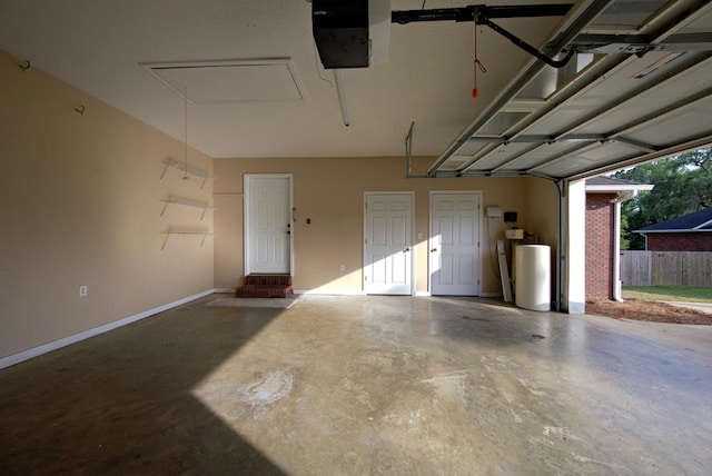 garage with baseboards and a garage door opener