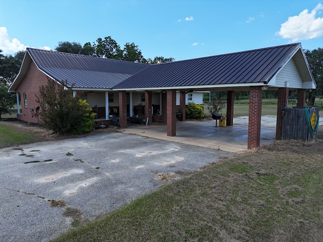 single story home featuring a carport