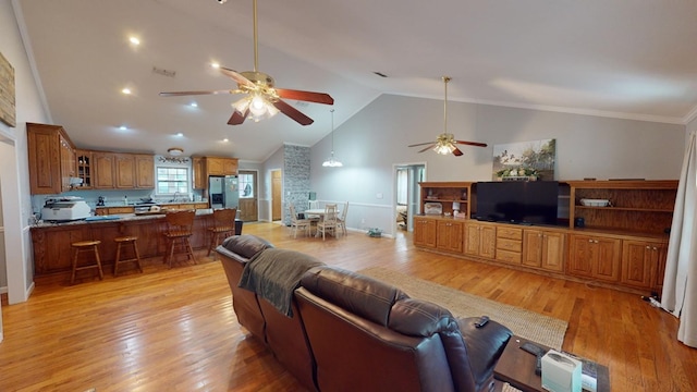 living room featuring ceiling fan, high vaulted ceiling, and light hardwood / wood-style floors