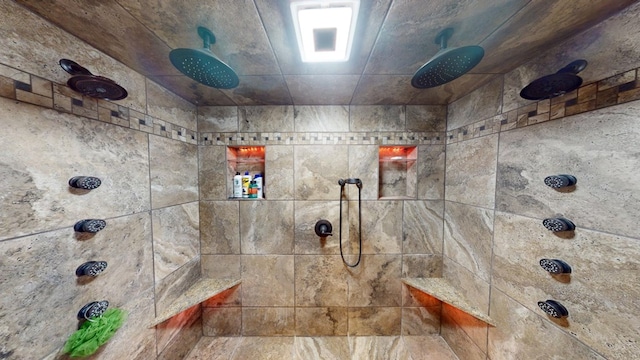 bathroom with a tile shower