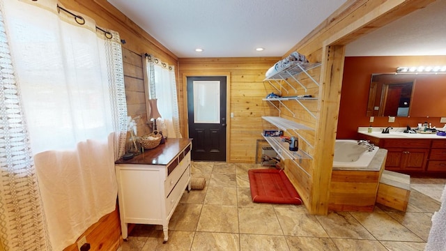 mudroom featuring sink and wooden walls