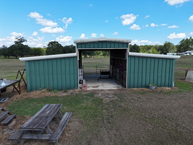 view of outdoor structure with a lawn