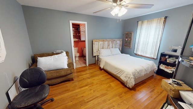 bedroom with light hardwood / wood-style floors, ceiling fan, and ensuite bathroom