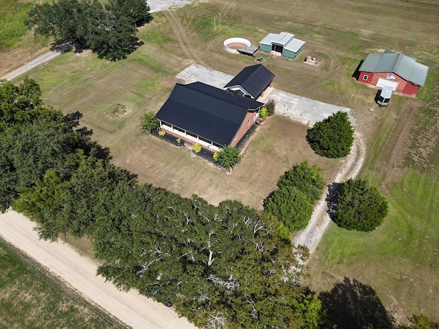 birds eye view of property with a rural view