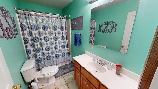 bathroom with vanity, toilet, curtained shower, and tile patterned flooring