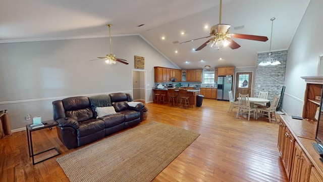 living room featuring high vaulted ceiling, ceiling fan, and light wood-type flooring