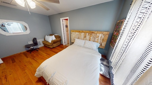 bedroom featuring wood-type flooring and ceiling fan