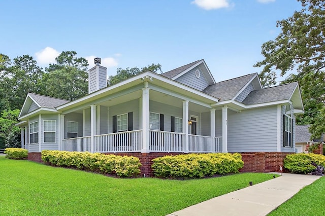 71 Buckfast Ct, Thomasville, GA 31792 - view of side of home featuring a yard, a chimney, roof with shingles, and covered porch