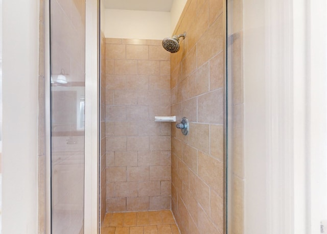 bathroom with tiled shower