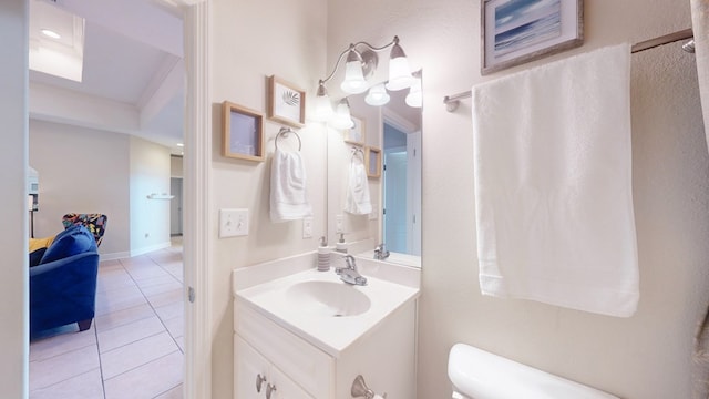 bathroom with tile patterned floors, vanity, and toilet