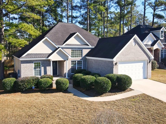 view of front of house featuring a garage and a front yard