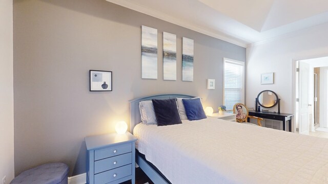 bedroom with crown molding