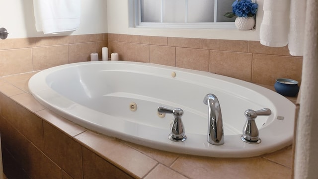 bathroom with tiled bath